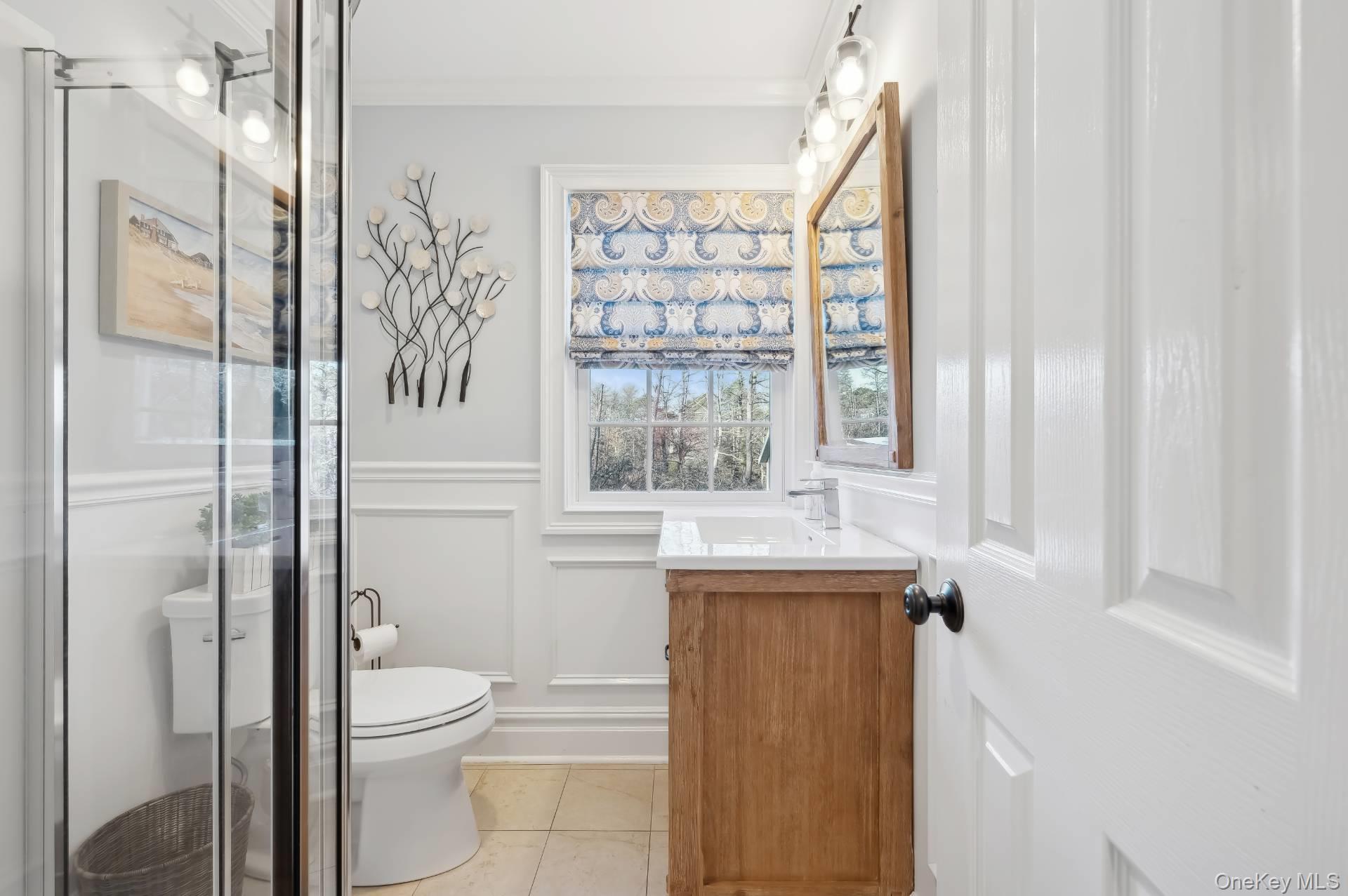 47 Bathing Beach Road Southampton, NY 11968 - Photo 11 of 20 a bathroom with a toilet sink and shower