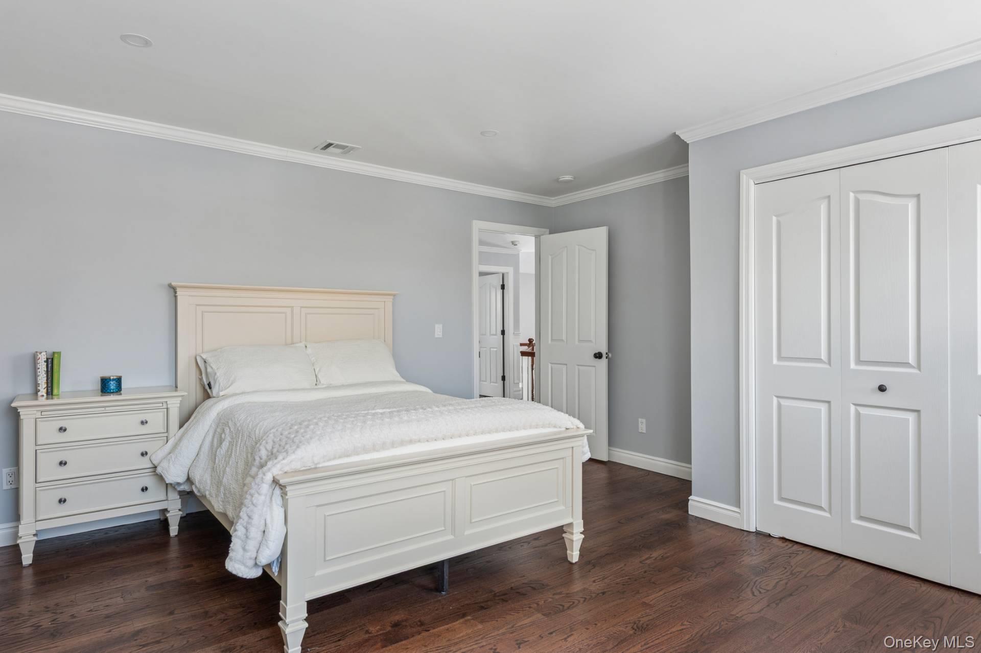47 Bathing Beach Road Southampton, NY 11968 - Photo 14 of 20 a bedroom with a bed and a closet