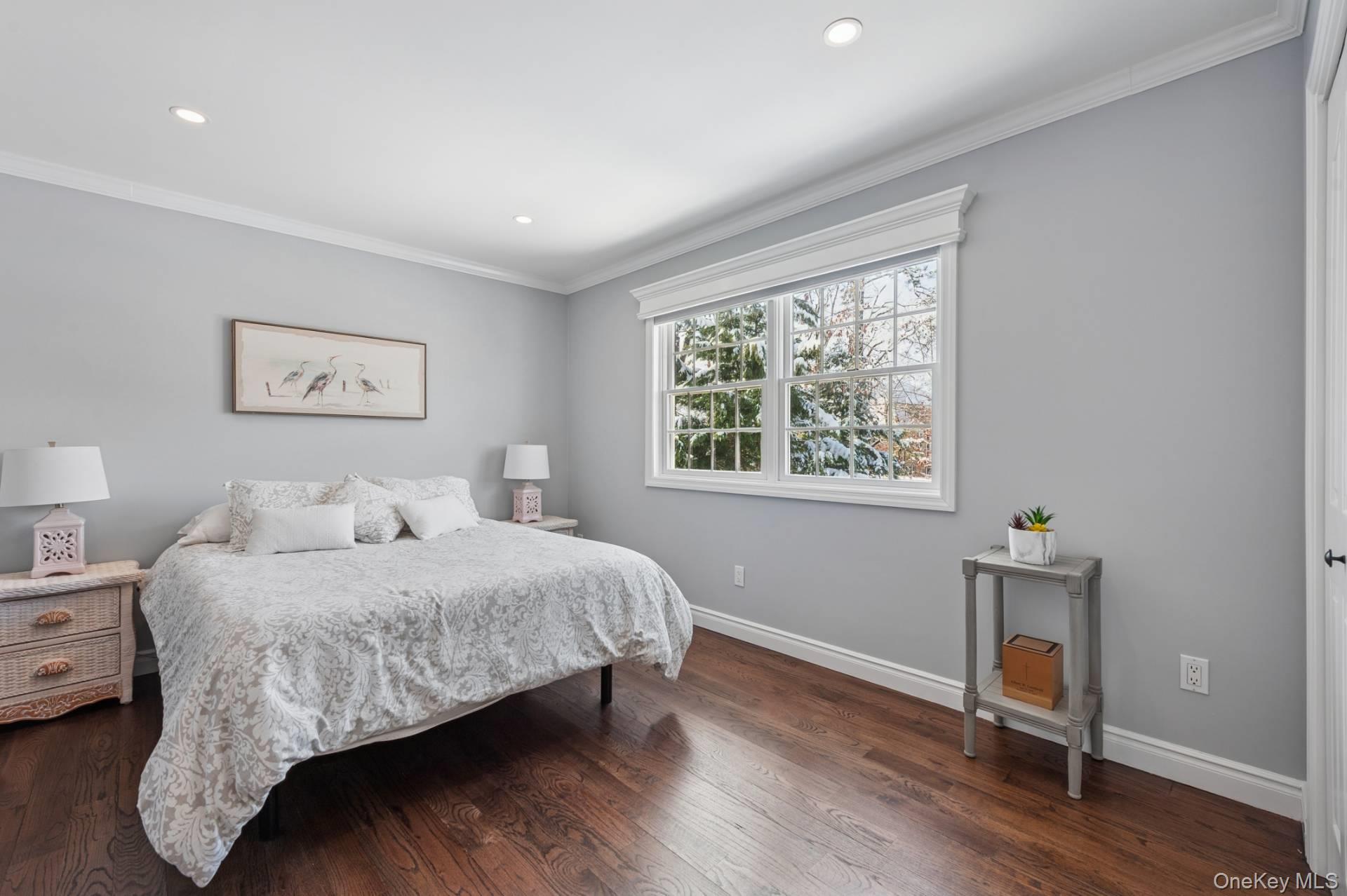 47 Bathing Beach Road Southampton, NY 11968 - Photo 15 of 20 a bedroom with a bed and a window