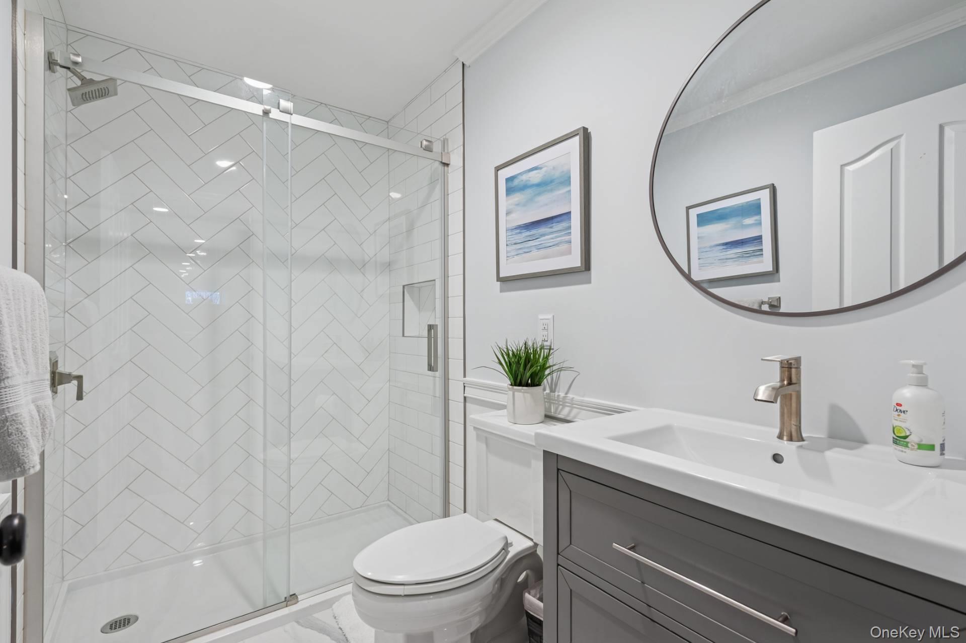 47 Bathing Beach Road Southampton, NY 11968 - Photo 20 of 20 a bathroom with a sink a toilet and shower
