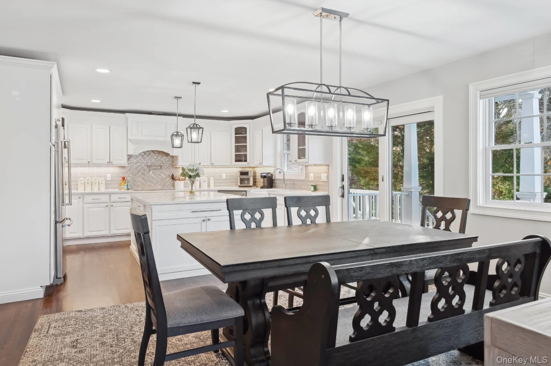 47 Bathing Beach Road Southampton, NY 11968 - Photo 6 of 20 a view of a dining room with furniture window and wooden floor