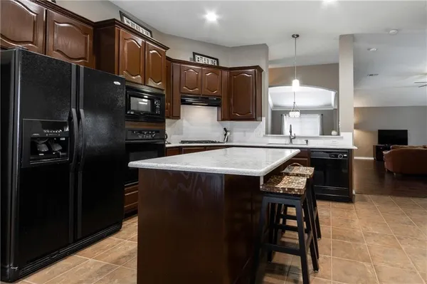 a view of a house with backyard and porch