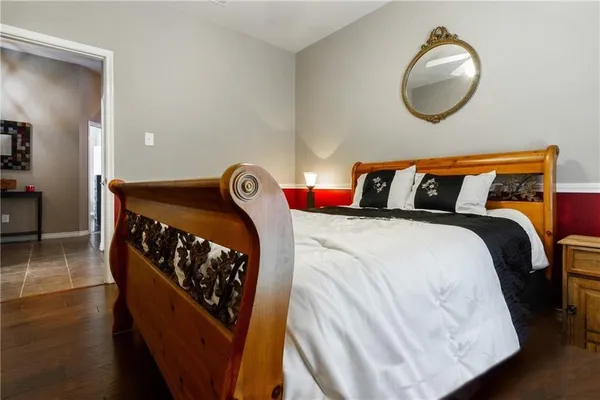 a bedroom with a bed and dresser