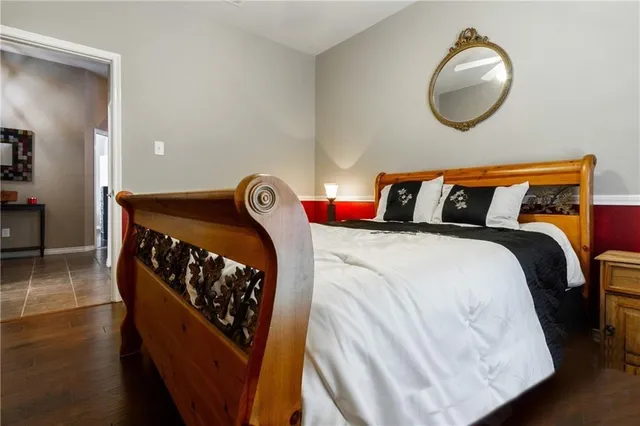 a bedroom with a bed and dresser