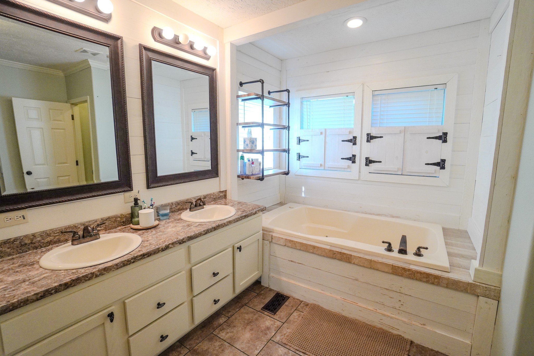 137 Hawkins Road Westmoreland, TN 37186 - Photo 58 of 71 a bathroom with a granite countertop tub sink double vanity granite and a mirror