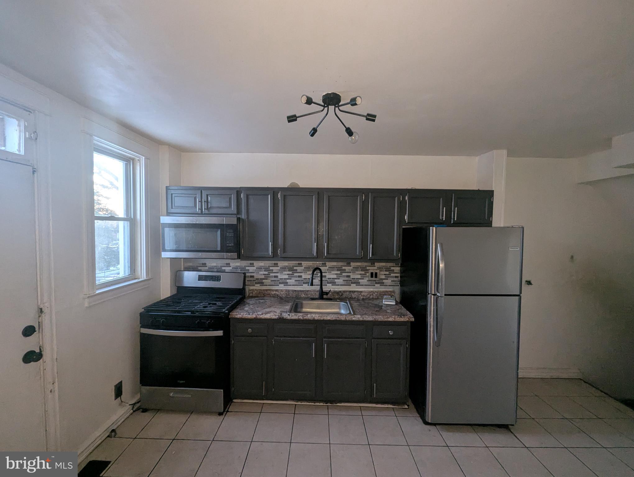 3602 Chesterfield Avenue Baltimore, MD 21213 - Photo 11 of 37 Modern kitchen with sleek finishes.