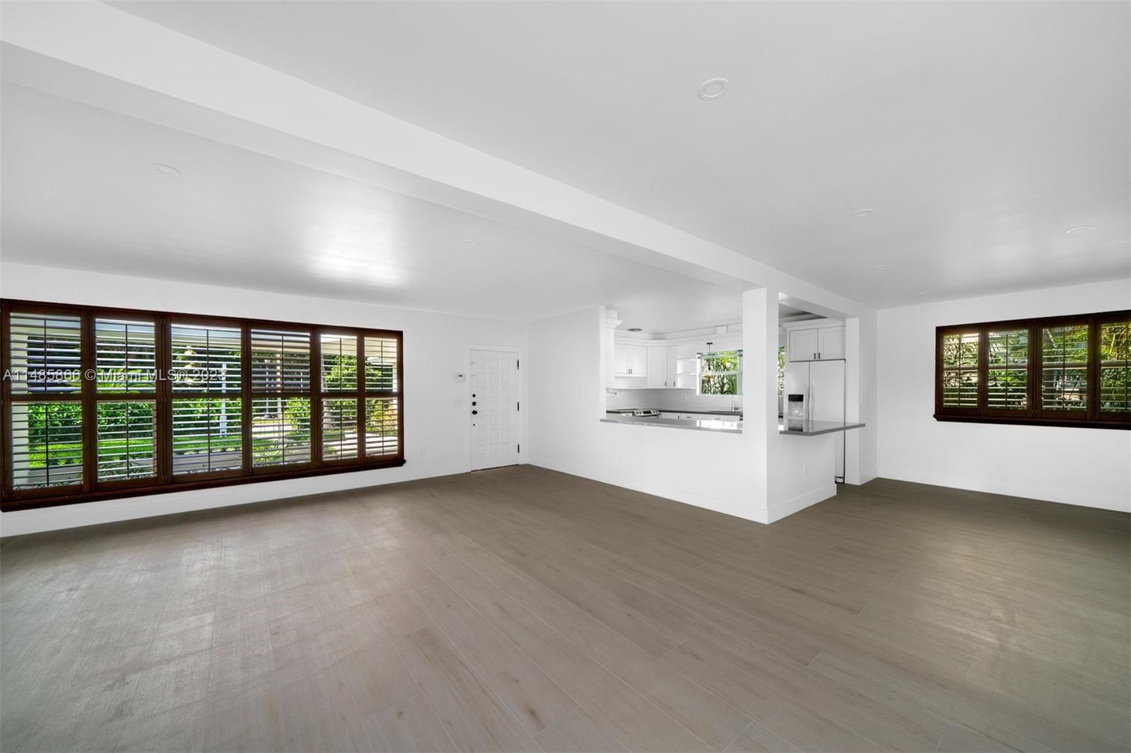 2385 North Bay Road Miami Beach, FL 33140 - Photo 12 of 36 a view of an empty room with a window