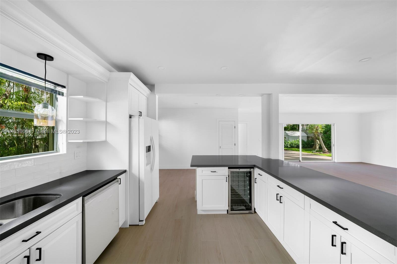 2385 North Bay Road Miami Beach, FL 33140 - Photo 13 of 36 a kitchen with a sink and a window