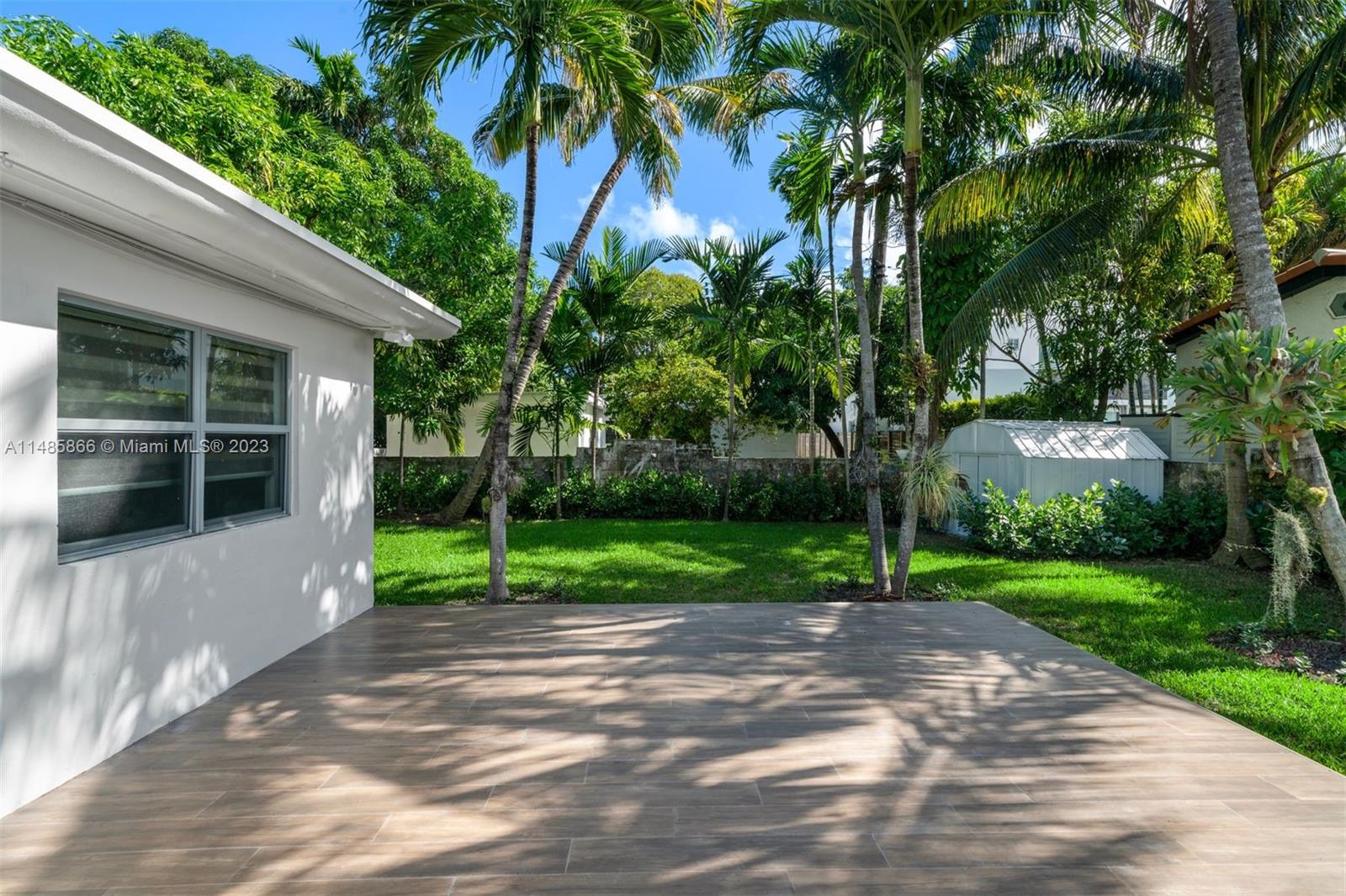 2385 North Bay Road Miami Beach, FL 33140 - Photo 30 of 36 a view of a yard with plants and trees