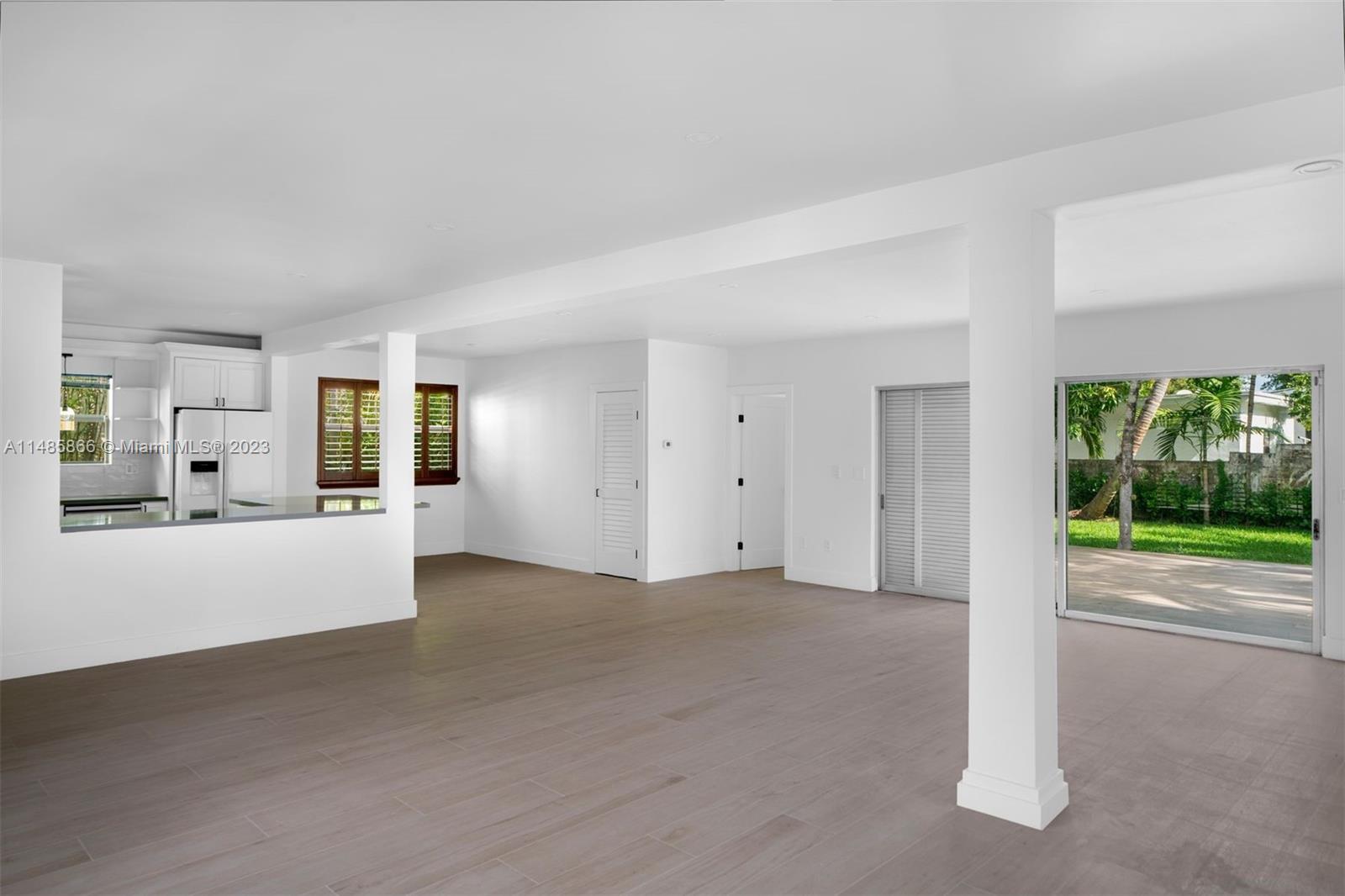 2385 North Bay Road Miami Beach, FL 33140 - Photo 8 of 36 a view of an empty room with a window