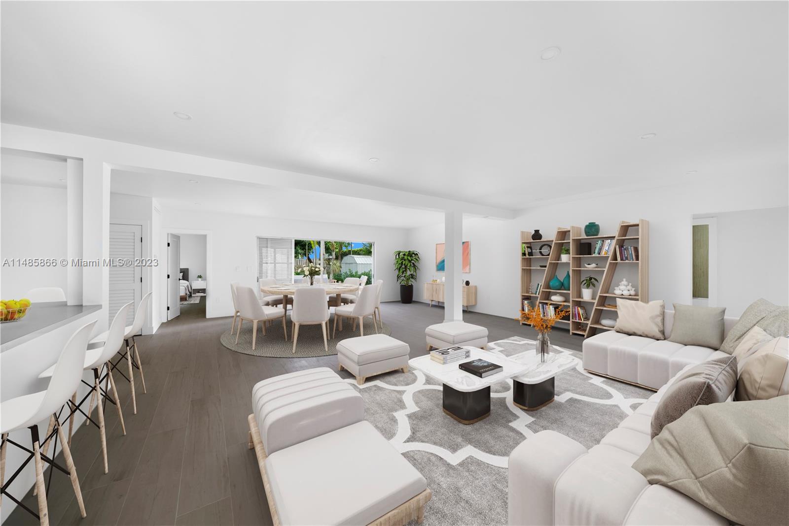 2385 North Bay Road Miami Beach, FL 33140 - Photo 9 of 36 a living room with furniture and a large window