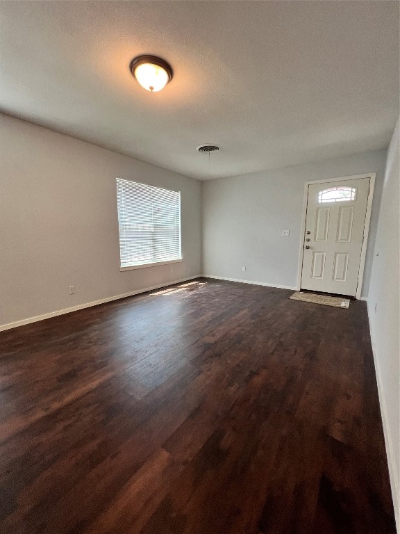 6003 Cameron Road, Unit A Austin, TX 78723 - Photo 14 of 25 an empty room with wooden floor and windows