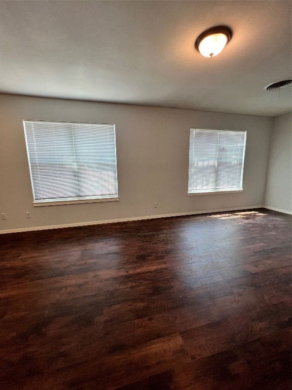 6003 Cameron Road, Unit A Austin, TX 78723 - Photo 15 of 25 an empty room with wooden floor and windows