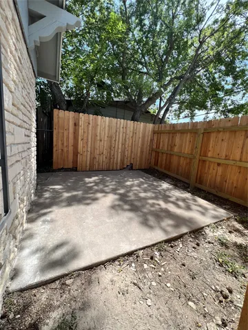 a view of a backyard of the house