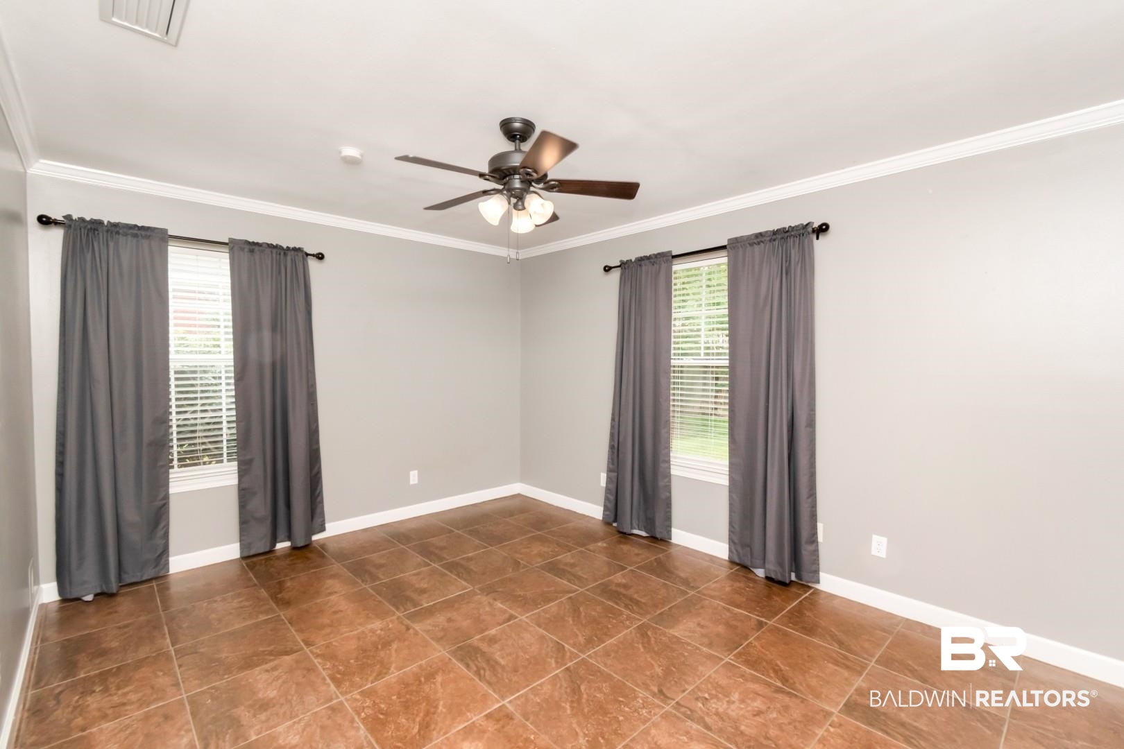10691 Hunters Ridge Drive Mobile, AL 36695 - Photo 19 of 37 Spacious room featuring broad tile flooring and a ceiling fan with integrated lighting