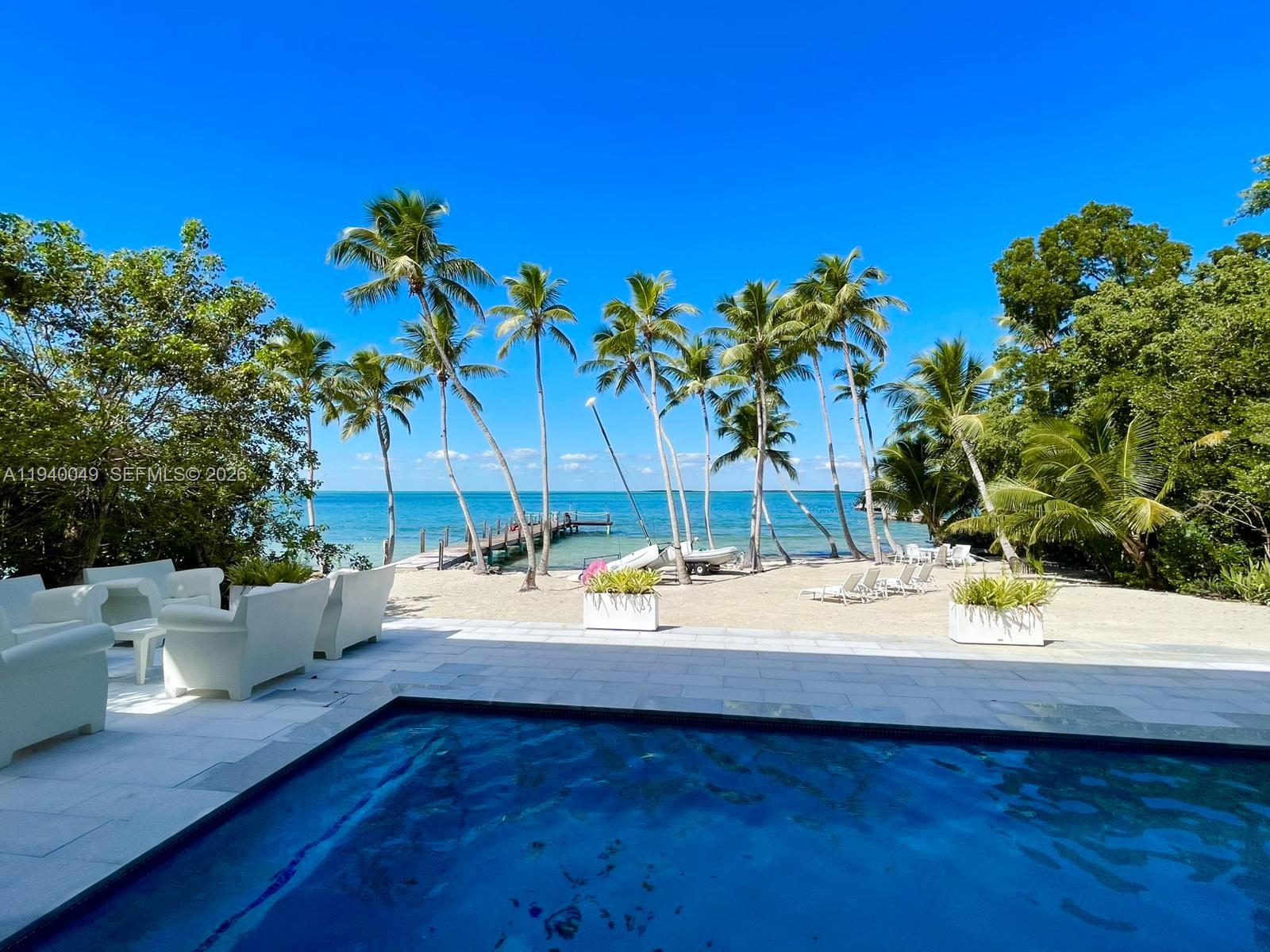 96180 Overseas Highway, Unit 1 Key Largo, FL 33037 - Photo 38 of 83 a view of a terrace with a sitting space