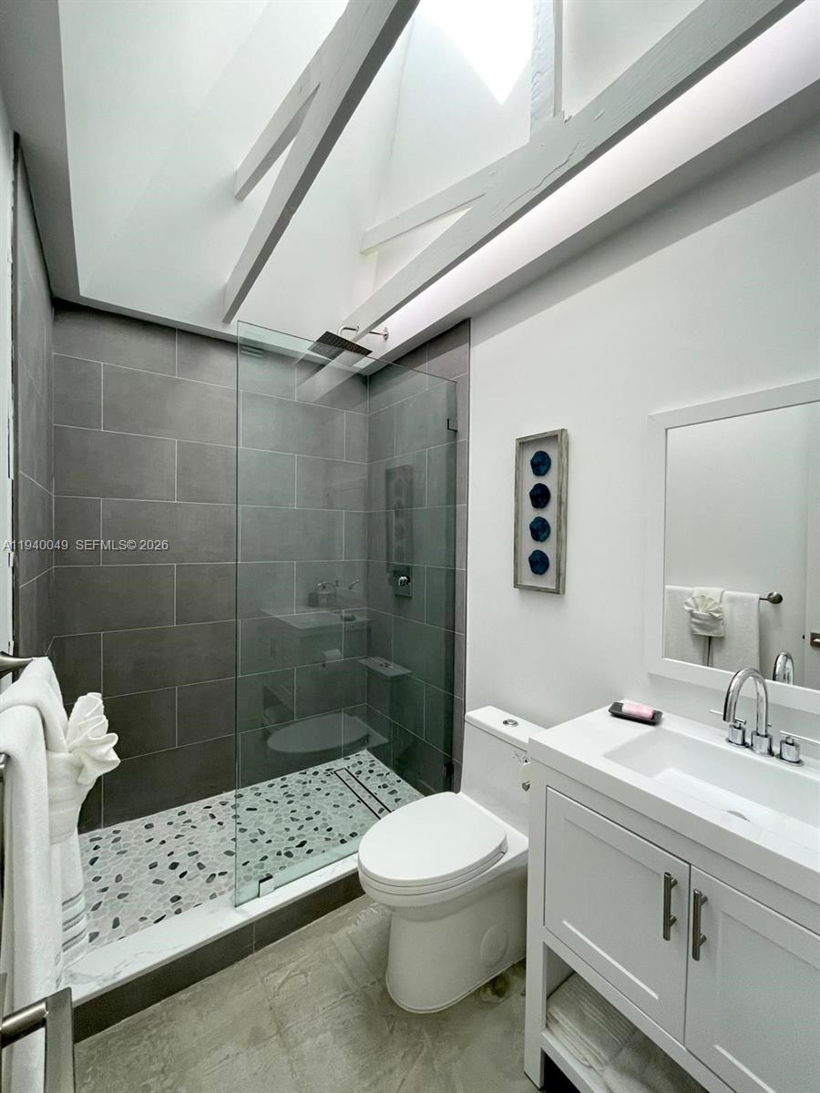 96180 Overseas Highway, Unit 1 Key Largo, FL 33037 - Photo 64 of 83 a bathroom with a sink a toilet and shower