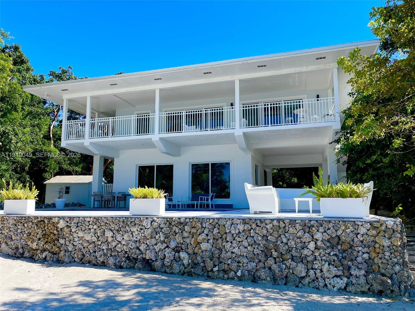 96180 Overseas Highway, Unit 1 Key Largo, FL 33037 - Photo 83 of 83 a front view of house with outdoor space