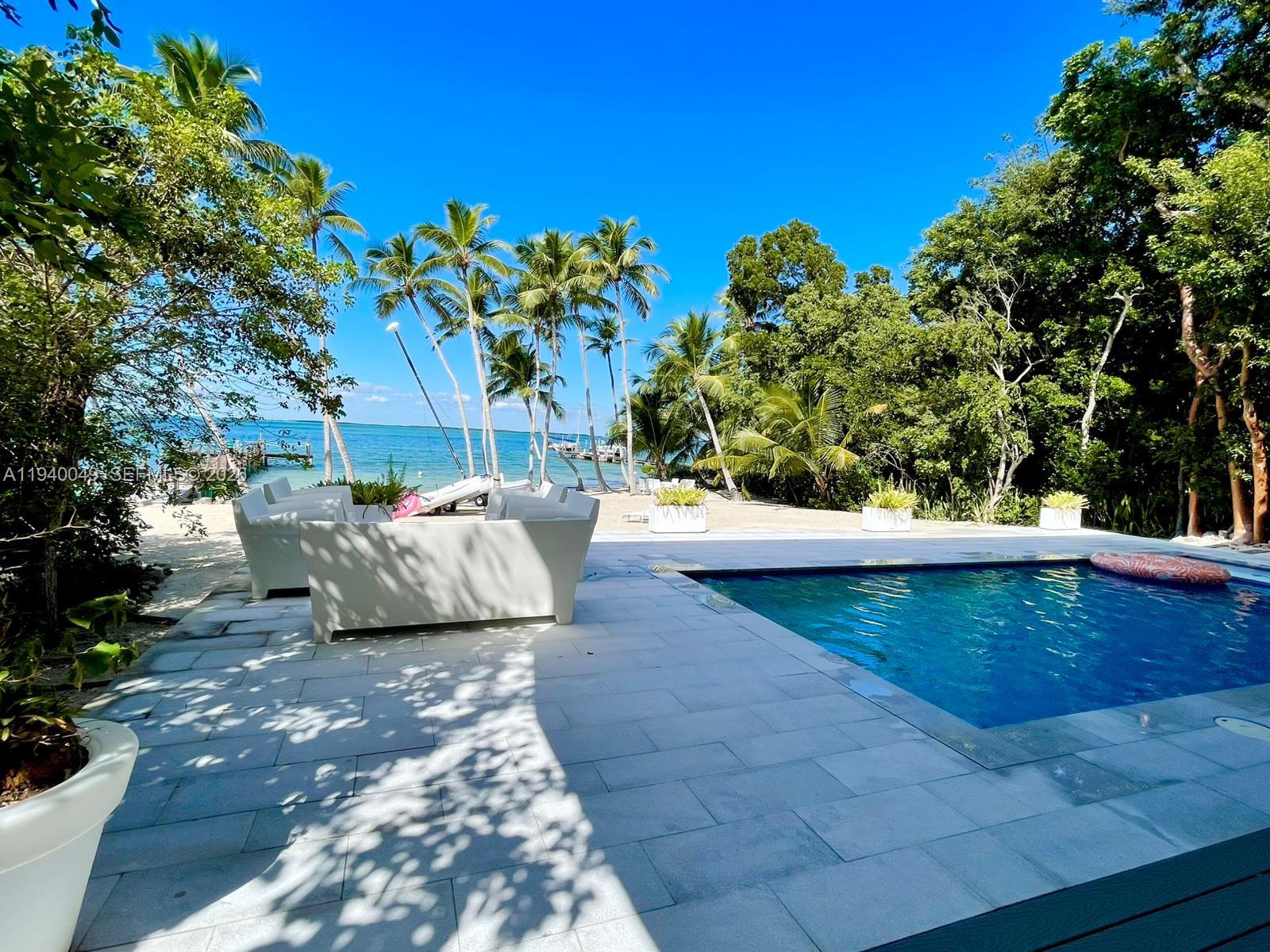 96180 Overseas Highway, Unit 1 Key Largo, FL 33037 - Photo 10 of 83 a view of a back yard of the house