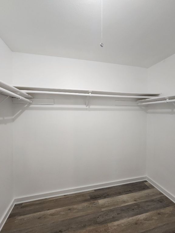 6905 Argonne Forest Cove, Unit A Austin, TX 78759 - Photo 12 of 18 a view of a room with racks on the wall