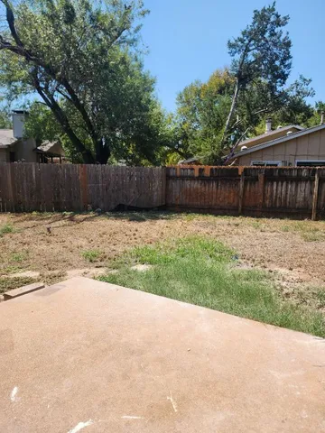 a swimming pool with wooden fence