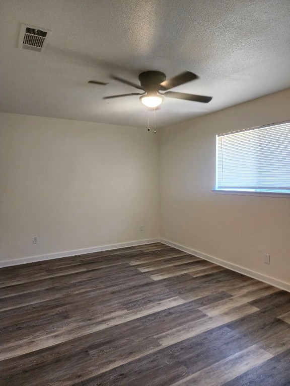 6905 Argonne Forest Cove, Unit A Austin, TX 78759 - Photo 8 of 18 a view of an empty room with wooden floor