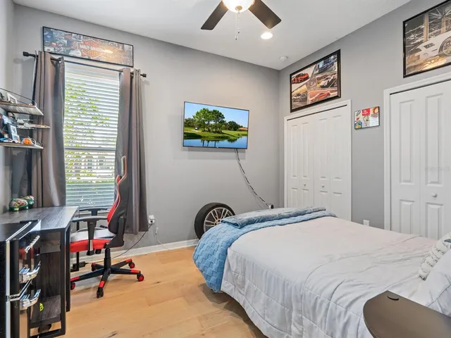 a bathroom with a sink mirror vanity and toilet