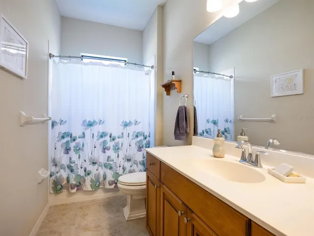 a dining room with furniture and floor to ceiling windows