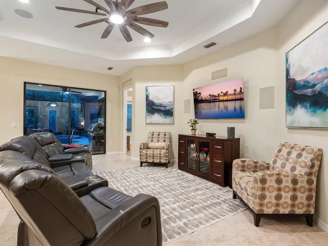 a view of a lake with a yard and large trees