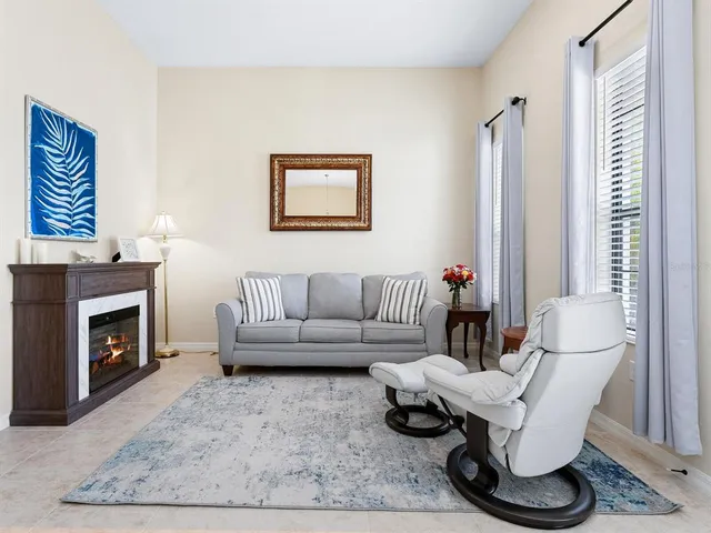 a living room with furniture and a large window