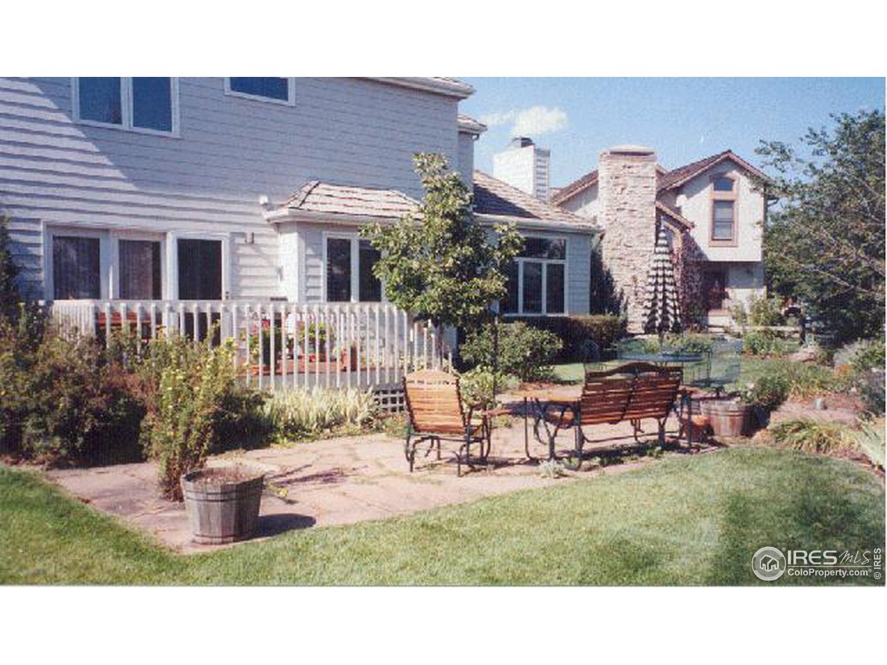 7229 Four Rivers Road Boulder, CO 80301 - Photo 11 of 12 a backyard of a house with yard and outdoor seating