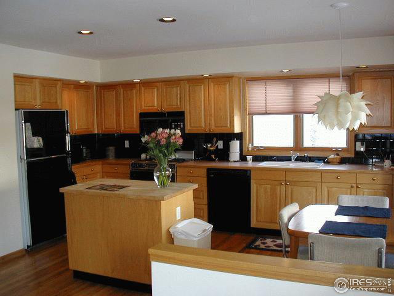 7229 Four Rivers Road Boulder, CO 80301 - Photo 3 of 12 a kitchen with stainless steel appliances granite countertop a refrigerator sink and cabinets