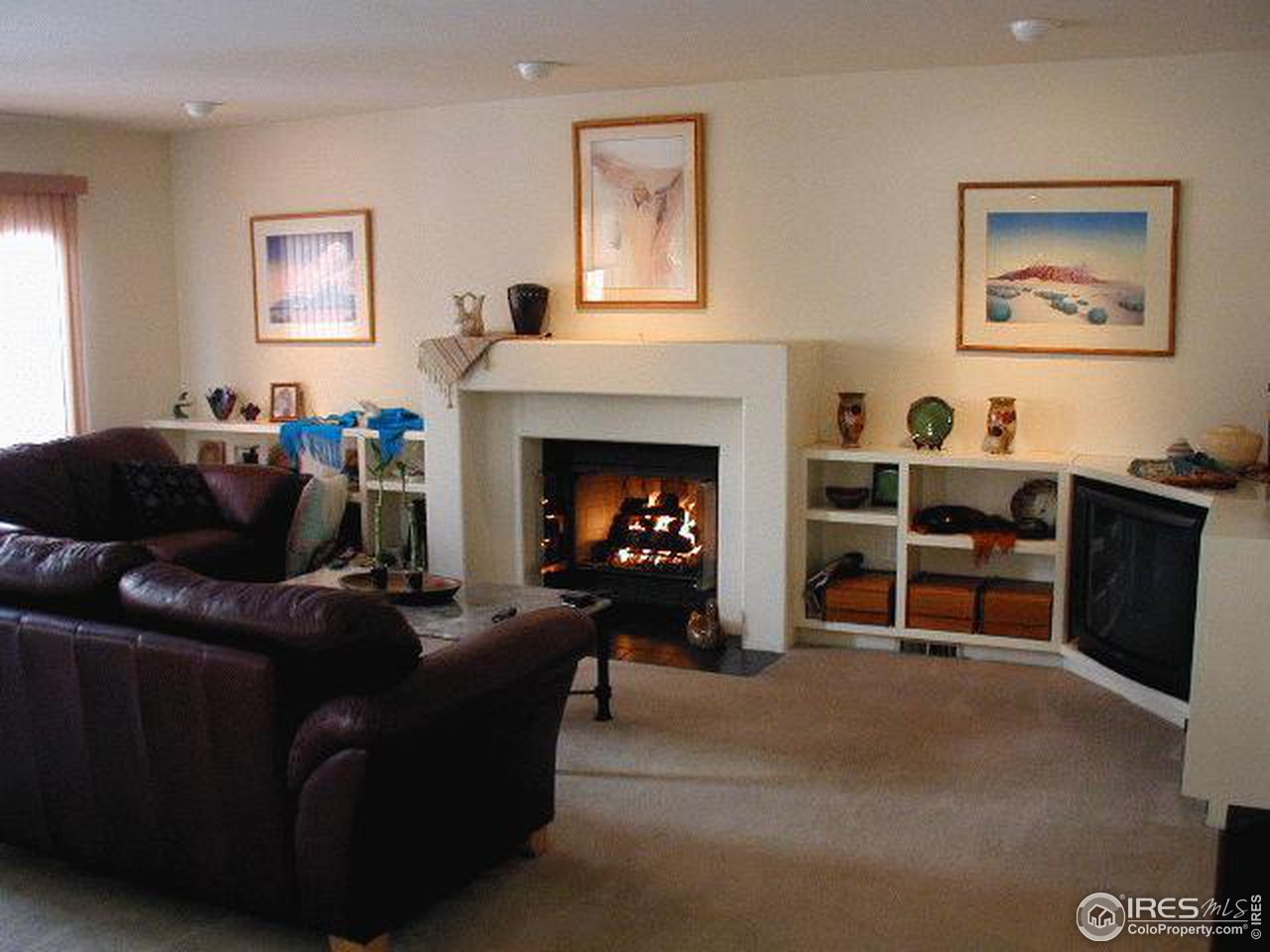 7229 Four Rivers Road Boulder, CO 80301 - Photo 4 of 12 a living room with furniture and a fireplace