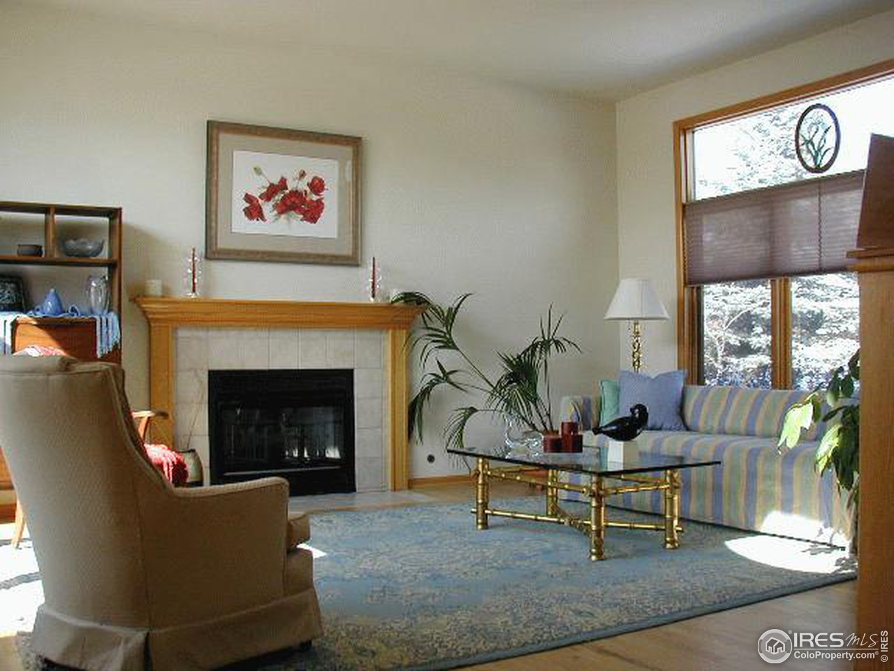 7229 Four Rivers Road Boulder, CO 80301 - Photo 5 of 12 a living room with furniture a table and a fireplace