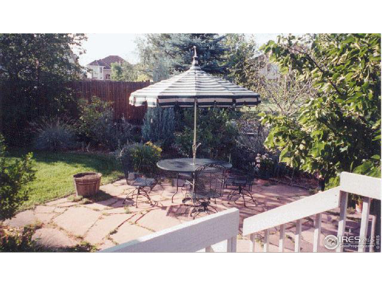 7229 Four Rivers Road Boulder, CO 80301 - Photo 9 of 12 a backyard of a house with table and chairs