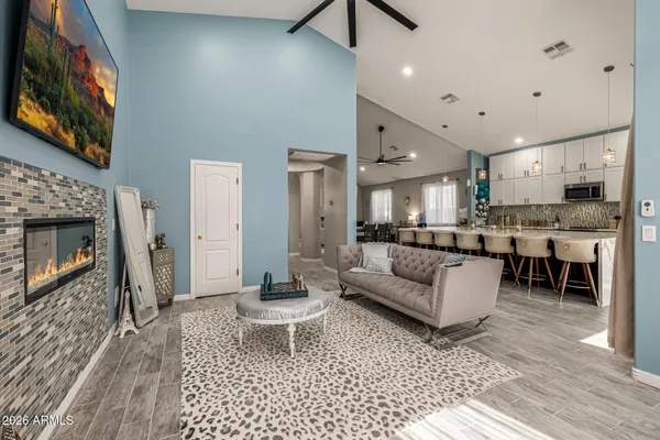 a kitchen with stainless steel appliances kitchen island a chandelier