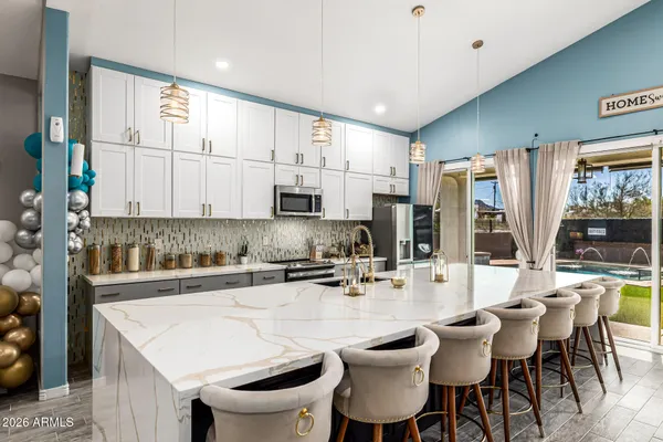 a living room with furniture fireplace and a table