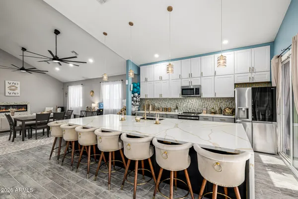 a room with pool table and a chandelier