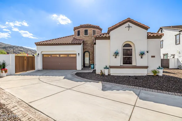 a front view of a house with a garage