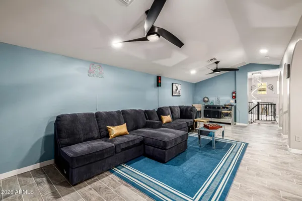 a bedroom with a bed and a desk