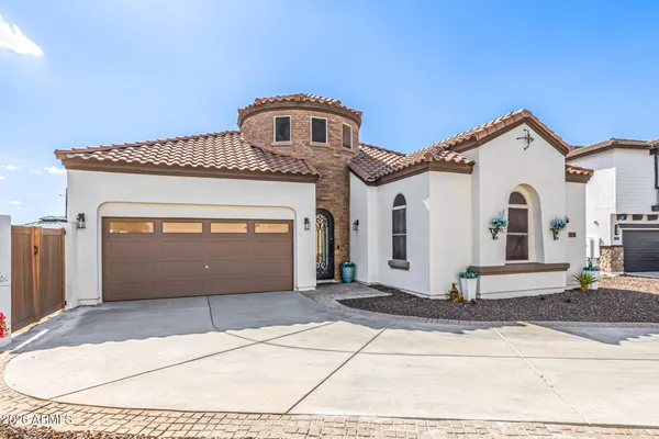 a living room with lots of furniture and a chandelier
