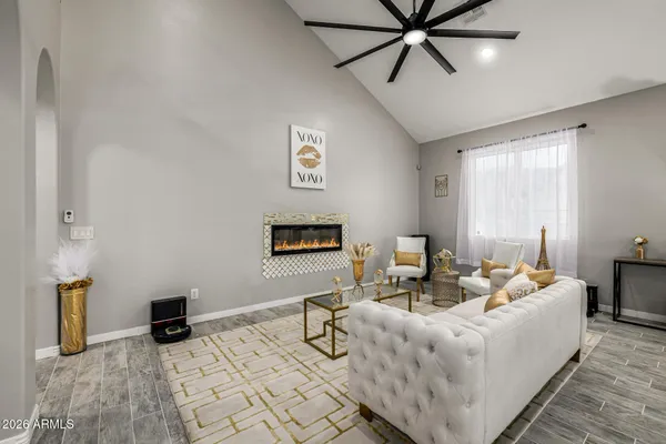 a living room with furniture and a large window