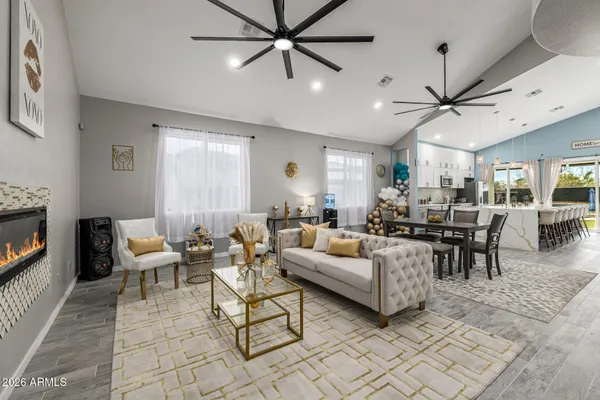 a living room with furniture and a fireplace