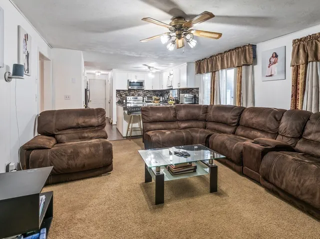 a living room with furniture and a couch