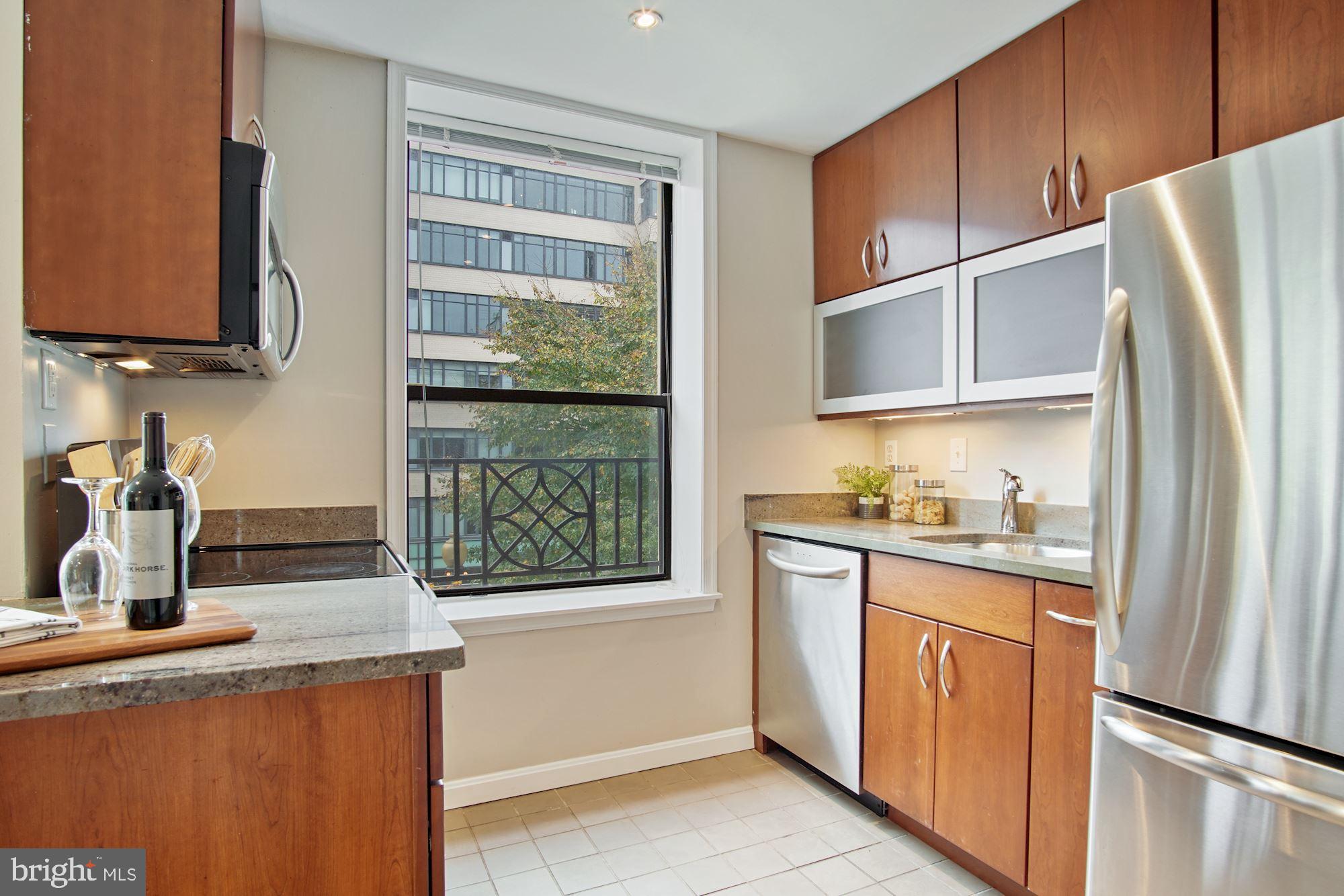 2145 California Street Northwest, Unit 201 Washington, DC 20008 - Photo 14 of 30 Granite counters and solid wood cabinets