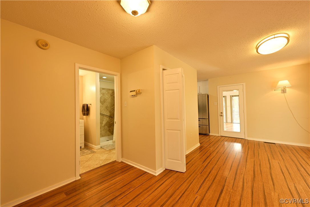 6610 Glebe Point Road Chesterfield, VA 23838 - Photo 11 of 36 a view of a room with wooden floor and brick walls