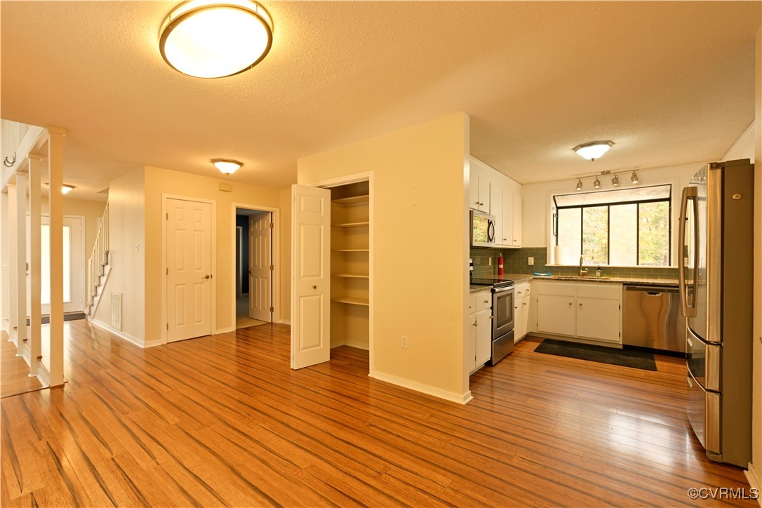 6610 Glebe Point Road Chesterfield, VA 23838 - Photo 12 of 36 a view of a kitchen with wooden floor and a kitchen