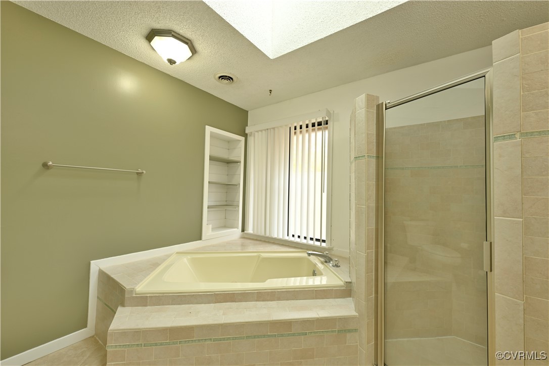 6610 Glebe Point Road Chesterfield, VA 23838 - Photo 27 of 36 a bathroom with a tub and a shower