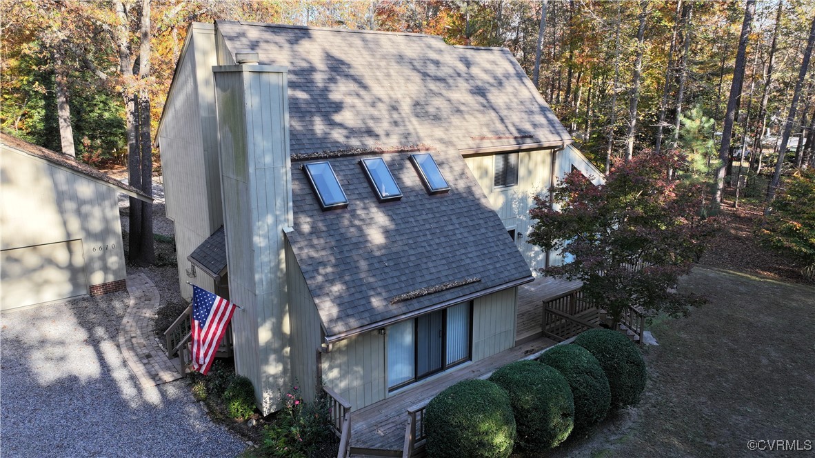 6610 Glebe Point Road Chesterfield, VA 23838 - Photo 7 of 36 a aerial view of a house with a yard and large trees