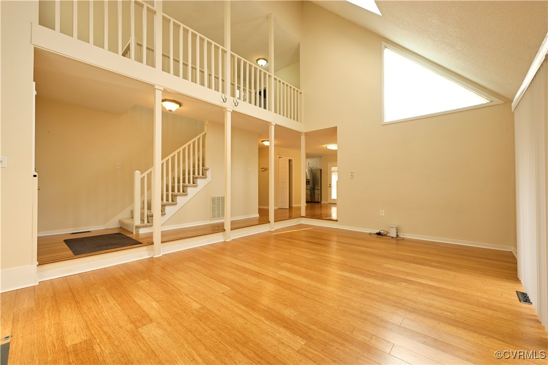 6610 Glebe Point Road Chesterfield, VA 23838 - Photo 9 of 36 Unfurnished living room featuring a high ceiling a